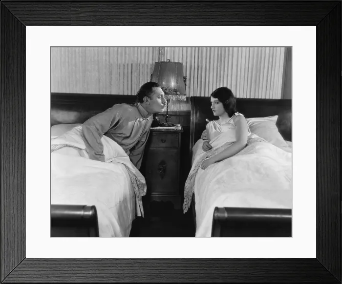 Framed Print : Couple in twin beds Framed Print : Couple in twin beds