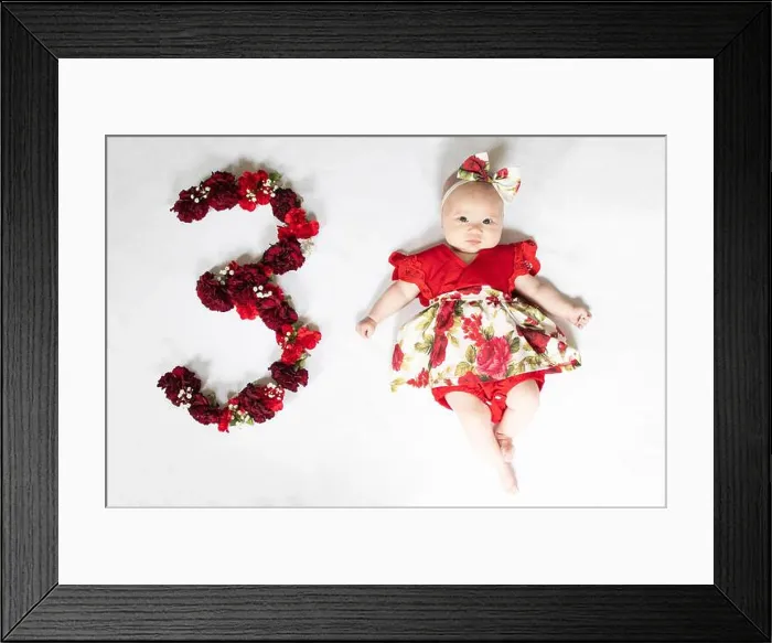 Framed Print : Little newborn baby girl in red dress. 3 month old baby Framed Print : Little newborn baby girl in red dress. 3 month old baby