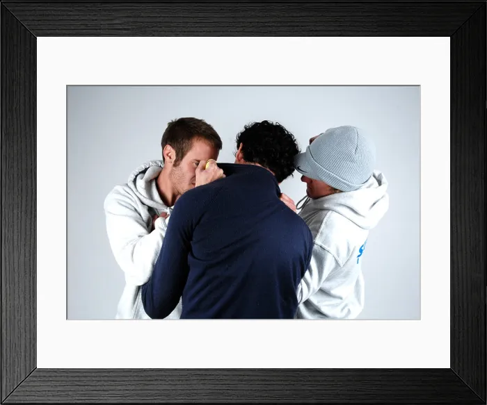 Framed Print : Two young men beating up a young man Framed Print : Two young men beating up a young man