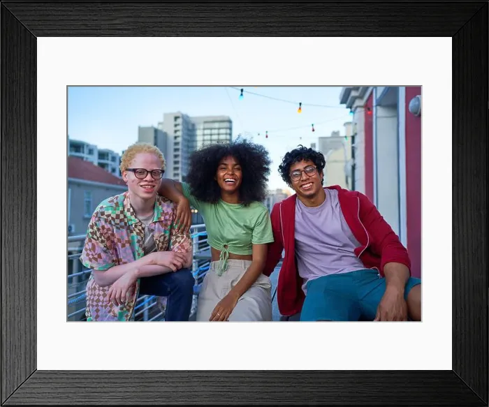 Framed Print : Portrait happy young friends on urban apartment balcony Framed Print : Portrait happy young friends on urban apartment balcony