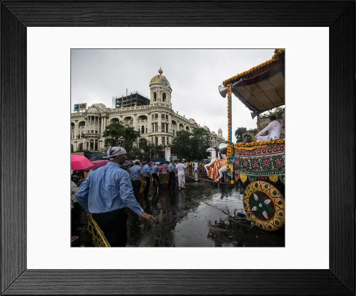 Framed Print : Return journey, Lord Jagannatha, in heavy rains, before heritage Metropolitan Building, Kolkata, India