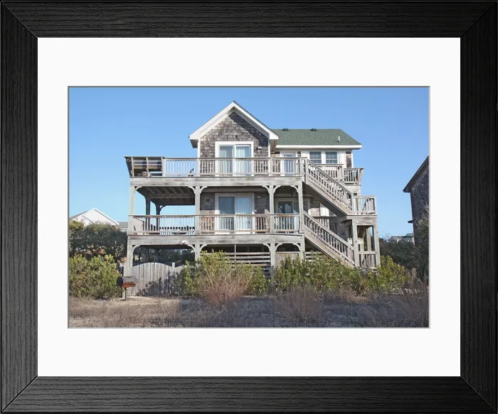 Framed Print : A beach house on the Outer Banks at Nags Head, North Carolina, against a bright blue sky Framed Print : A beach house on the Outer Banks at Nags Head, North Carolina, against a bright blue sky