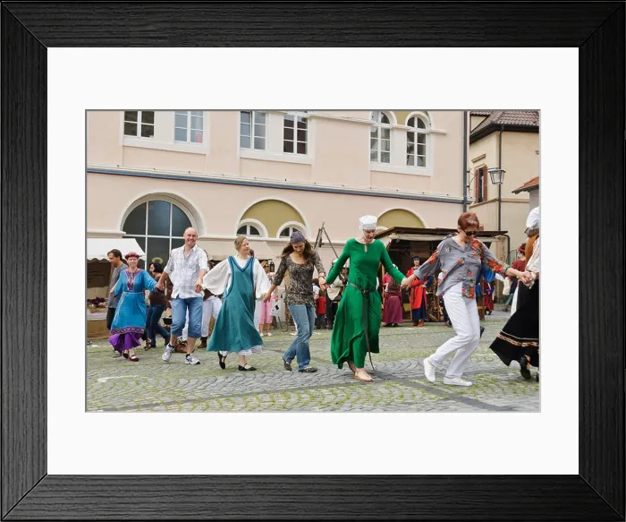 Framed Print : People in historic costumes dancing ethnic folkloristic dance on the street Framed Print : People in historic costumes dancing ethnic folkloristic dance on the street
