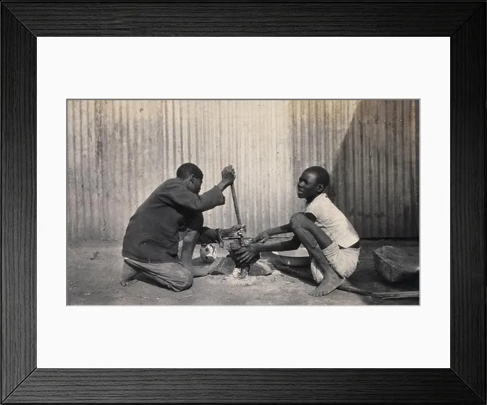 Framed Print : Umtali, Zimbabwe: two African boys stirring a cooking pot. Photograph by J. Lomas, 1905 Framed Print : Umtali, Zimbabwe: two African boys stirring a cooking pot. Photograph by J. Lomas, 1905