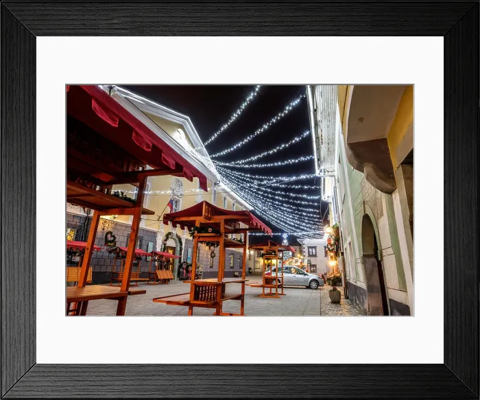 Framed Print : Old town square with Christmas decorations and empy stalls for the Christmas fair Framed Print : Old town square with Christmas decorations and empy stalls for the Christmas fair