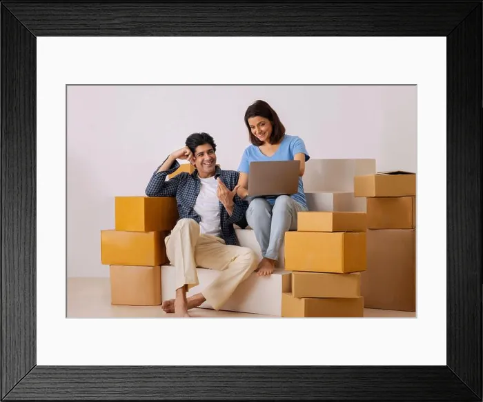 Framed Print : Indian middle age couple using laptop and planning for new ideas on the decoration of new room