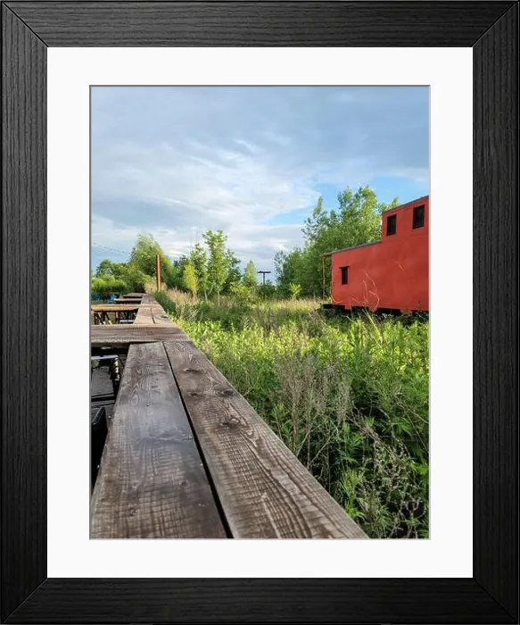 Framed Print : Old vintage abandoned train red caboose in a field Framed Print : Old vintage abandoned train red caboose in a field