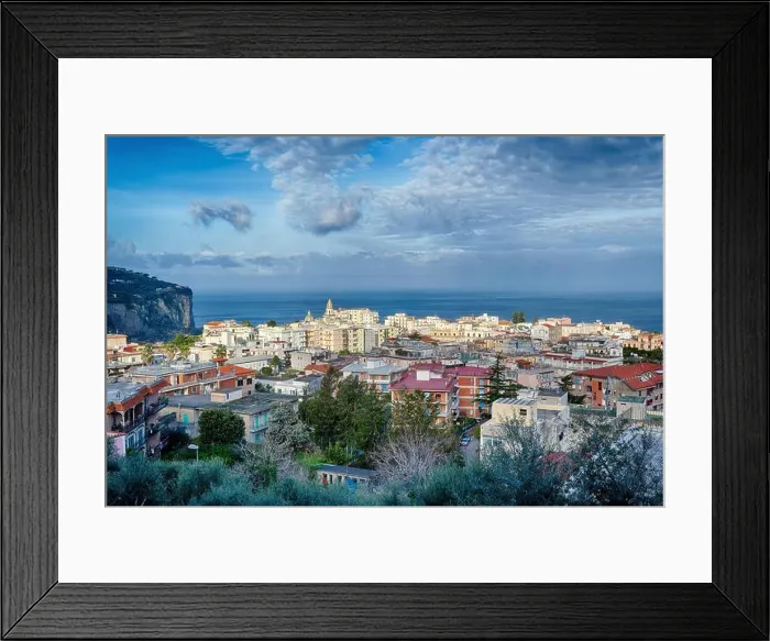 Framed Print : A beautiful view across the rooftops of vico equense and the bay of naples towards the island of ischia