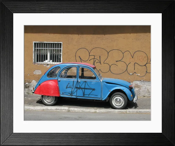 Framed Print : one citroen 2cv covered with graffiti in street in city town Framed Print : one citroen 2cv covered with graffiti in street in city town