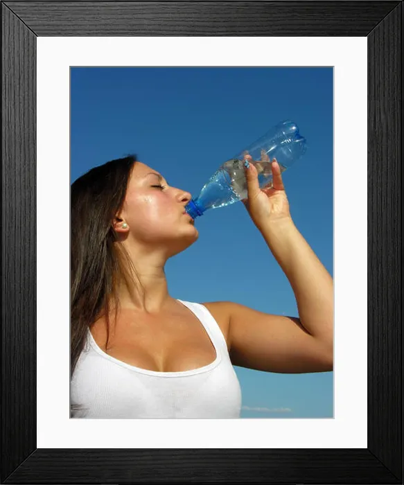 Framed Print : young athletic woman drinks cold water in hot day, vertical composition Framed Print : young athletic woman drinks cold water in hot day, vertical composition