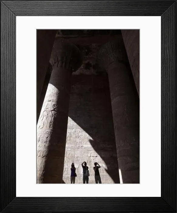 Framed Print : Edfu, Egypt - 1 December 2012 Man in the shadows of the Edfu Temple Framed Print : Edfu, Egypt - 1 December 2012 Man in the shadows of the Edfu Temple