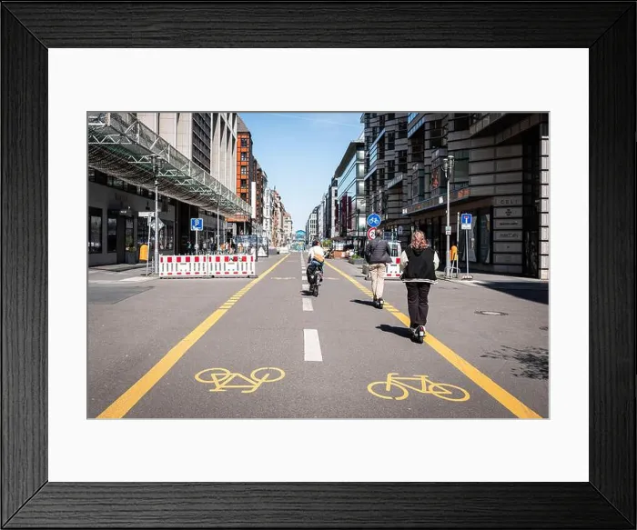 Framed Print : Berlin, Germany - April, 2022: People on Bicycle lane or pop-up bike lane in Berlin (Friedrichstrasse) Framed Print : Berlin, Germany - April, 2022: People on Bicycle lane or pop-up bike lane in Berlin (Friedrichstrasse)