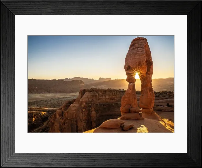 Framed Print : Setting sun through Delicate Arch with sunburst, Arches National Park, Utah, United States of America, North America