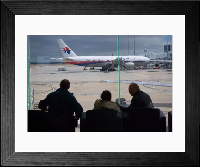 Framed Print : Passengers awaiting departure at Melbourne International airport with a Malaysian Airlines Boeing 777 200 Framed Print : Passengers awaiting departure at Melbourne International airport with a Malaysian Airlines Boeing 777 200