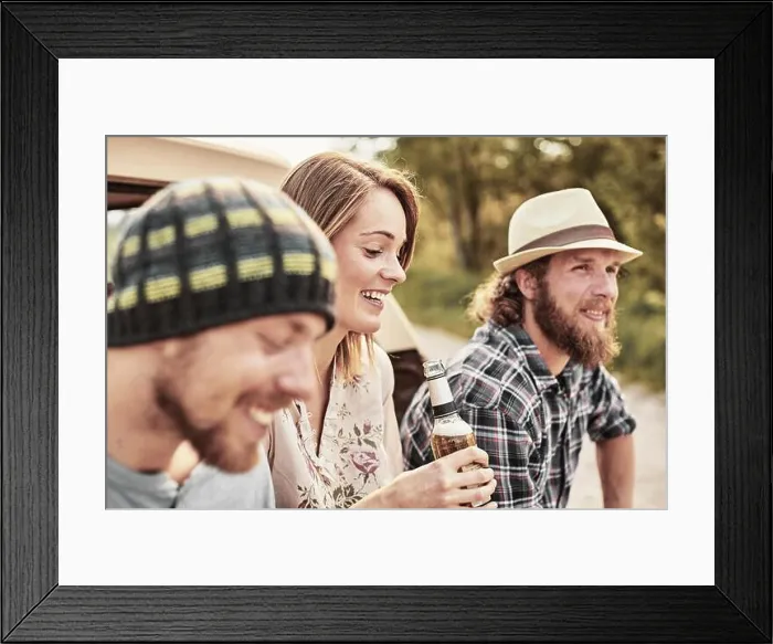 Framed Print : Three people holding bottled beer smiling Framed Print : Three people holding bottled beer smiling