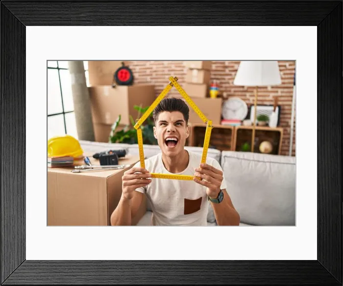 Framed Print : Young hispanic man moving to a new home angry and mad screaming frustrated and furious, shouting with anger looking up Framed Print : Young hispanic man moving to a new home angry and mad screaming frustrated and furious, shouting with anger looking up