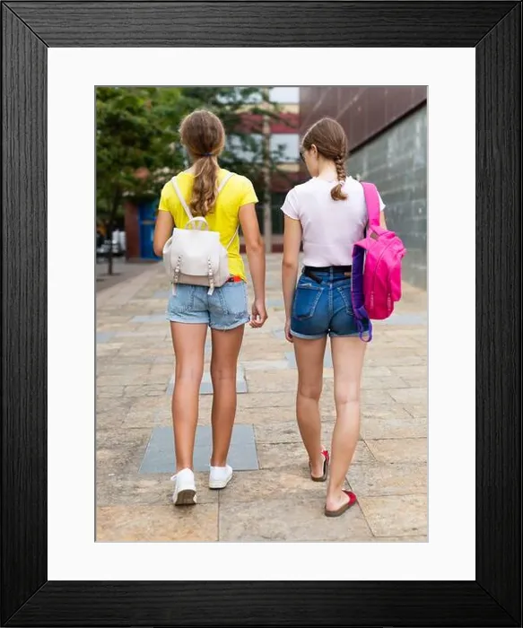 Framed Print : Teenager girls going home together after school