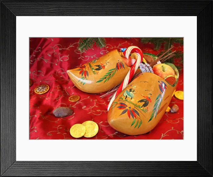 Framed Print : Wooden Shoes on a red background ready for St Nick Framed Print : Wooden Shoes on a red background ready for St Nick