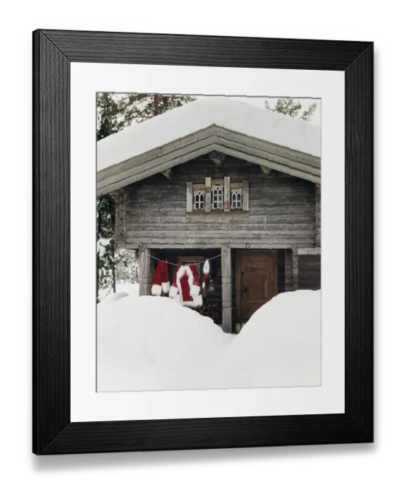 Framed Print : Washing line with Santa Claus clothes hanging outdoors in the snow. Framed Print : Washing line with Santa Claus clothes hanging outdoors in the snow.