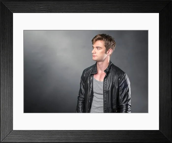 Framed Print : Puzzled thoughtful young man curiously looking at camera Framed Print : Puzzled thoughtful young man curiously looking at camera