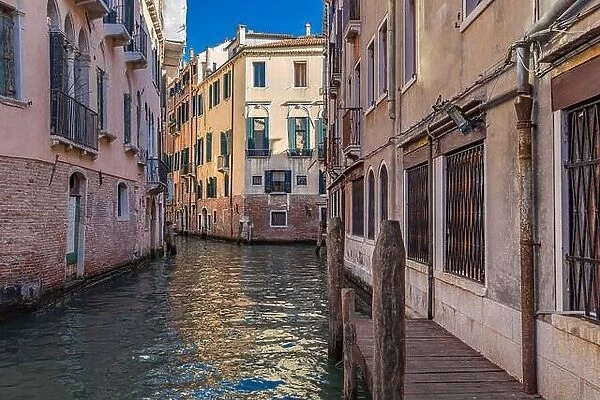 10.09.19 - Traditional canal street with gondola in Venice, Italy. Italy beauty, one of canal streets in, Venezia. Old canal with boats and bridge
