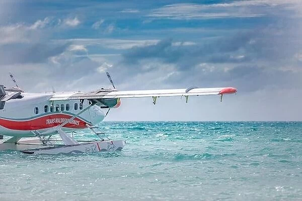 10.12.2018 -Male, Maldives: Seaplane is taking off at the airport in Maldives. Travel and exotic transportation seaplane. Island resort transportation