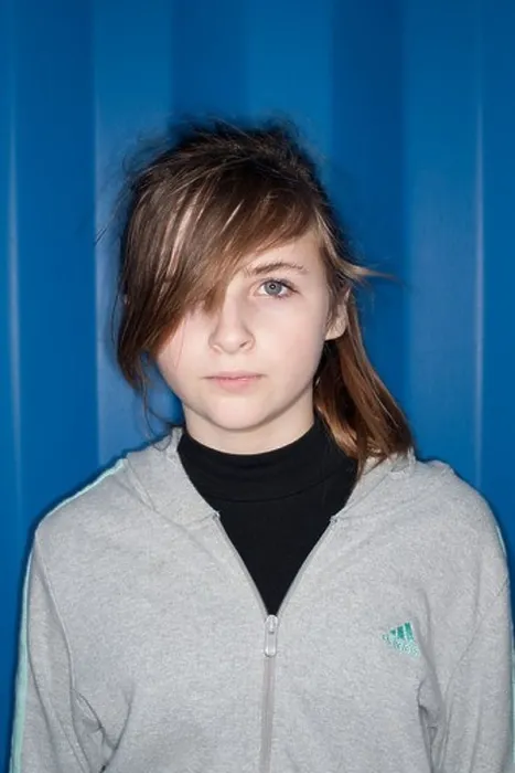 Framed Print : A 12 13 year old teenage girl with attitude - lit using direct harsh on-camera ring flash Framed Print : A 12 13 year old teenage girl with attitude - lit using direct harsh on-camera ring flash