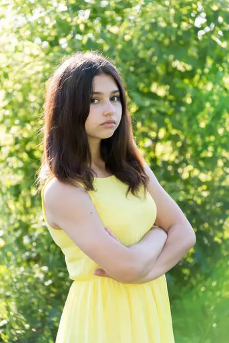 Framed Print : 14 year old girl with crossed arms on chest Framed Print : 14 year old girl with crossed arms on chest