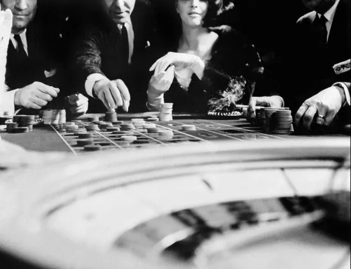 Framed Print : 1960s FOUR ANONYMOUS UNIDENTIFIED PEOPLE GAMBLING CASINO ROULETTE Framed Print : 1960s FOUR ANONYMOUS UNIDENTIFIED PEOPLE GAMBLING CASINO ROULETTE