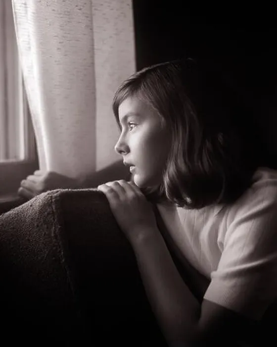 Framed Print : 1960s SERIOUS SAD TEENAGE GIRL SITTING IN DARKENED ROOM HOLDING BACK CURTAIN LOOKING OUT OF THE WINDOW WITH Framed Print : 1960s SERIOUS SAD TEENAGE GIRL SITTING IN DARKENED ROOM HOLDING BACK CURTAIN LOOKING OUT OF THE WINDOW WITH