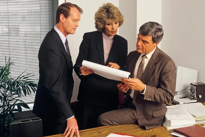 Framed Print : 1980s 3 EXECUTIVES HOLDING MEETING IN OFFICE REVIEWING PAPER WORK SPREAD SHEET - ko2797 NET002 HARS LEADER INFORMATION Framed Print : 1980s 3 EXECUTIVES HOLDING MEETING IN OFFICE REVIEWING PAPER WORK SPREAD SHEET - ko2797 NET002 HARS LEADER INFORMATION
