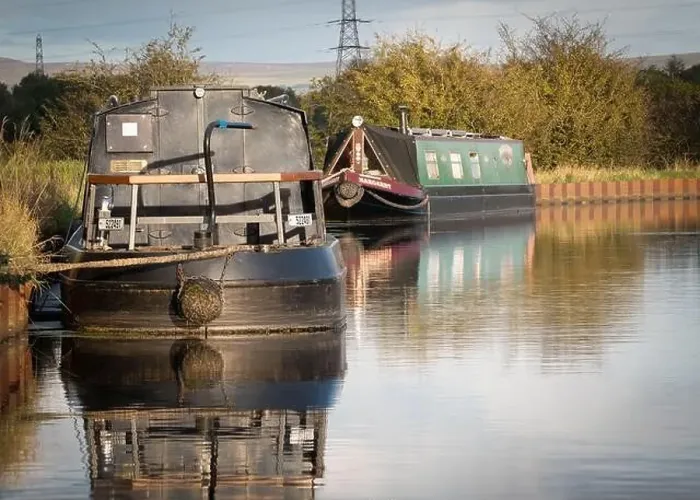 Framed Print : 2 narrow boats moored on the Leeds Liverpool canal in Altham, Accrington, Lancashire. England Framed Print : 2 narrow boats moored on the Leeds Liverpool canal in Altham, Accrington, Lancashire. England