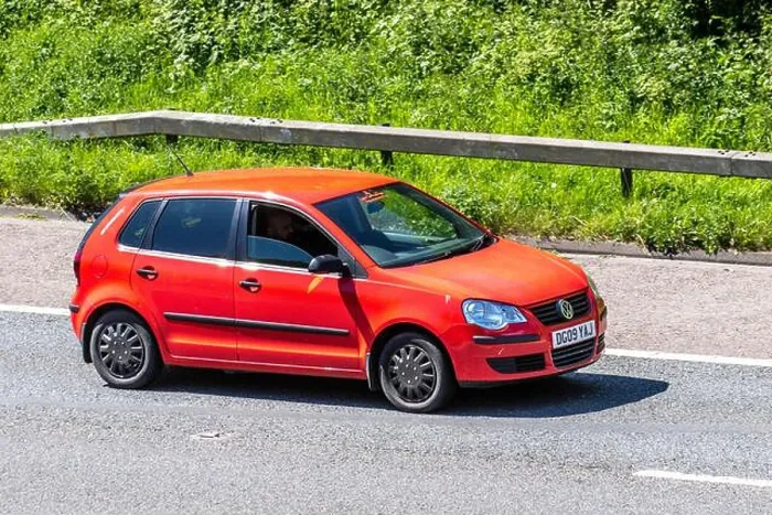 Framed Print : 2009 red Volkswagen Polo E 60; Vehicular traffic moving vehicles Framed Print : 2009 red Volkswagen Polo E 60; Vehicular traffic moving vehicles