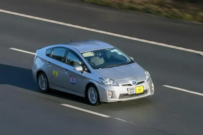 Framed Print : 2010 Toyota Prius T Spirit Vvt-I Cvt Silver Hybrid Electric taxi car driving on the M6 motorway near Preston Framed Print : 2010 Toyota Prius T Spirit Vvt-I Cvt Silver Hybrid Electric taxi car driving on the M6 motorway near Preston