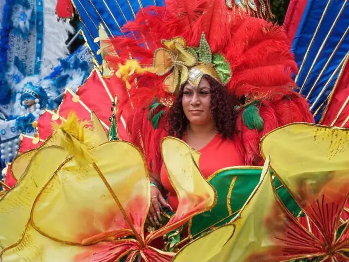 Framed Print : 2022 August 29 - UK - Yorkshire - Leeds West Indian Carnival - Colourful trope leader in the parade on Harehills Lane Framed Print : 2022 August 29 - UK - Yorkshire - Leeds West Indian Carnival - Colourful trope leader in the parade on Harehills Lane