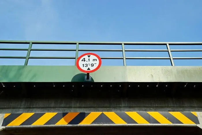 Framed Print : 4.1m, 13 9' bridge height sign, with black and yellow warning stripe on rural tunnel Framed Print : 4.1m, 13 9' bridge height sign, with black and yellow warning stripe on rural tunnel