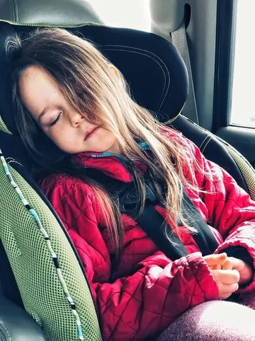 Framed Print : 5 year old girl sleeping in forward facing car seat with 5 point harness and long hair covering half her face Framed Print : 5 year old girl sleeping in forward facing car seat with 5 point harness and long hair covering half her face