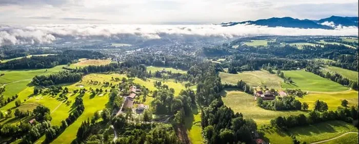 Framed Print : Aerial Bad Toelz Bavarian Alps. Golf Course. Blomberg Mountain. Morning Drone Shot with some clouds in the sky