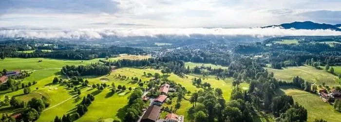 Framed Print : Aerial Bad Toelz Bavarian Alps. Golf Course. Blomberg Mountain. Morning Drone Shot with some clouds in the sky Framed Print : Aerial Bad Toelz Bavarian Alps. Golf Course. Blomberg Mountain. Morning Drone Shot with some clouds in the sky