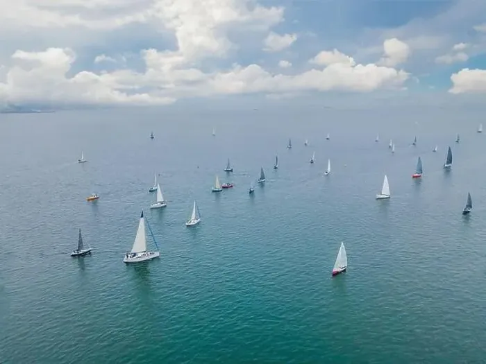 Framed Print : Aerial bird's eye view photo taken by drone of sailboat in turquoise sea water Framed Print : Aerial bird's eye view photo taken by drone of sailboat in turquoise sea water