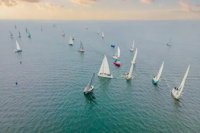 Framed Print : Aerial bird's eye view photo taken by drone of sailboat in turquoise sea water Framed Print : Aerial bird's eye view photo taken by drone of sailboat in turquoise sea water