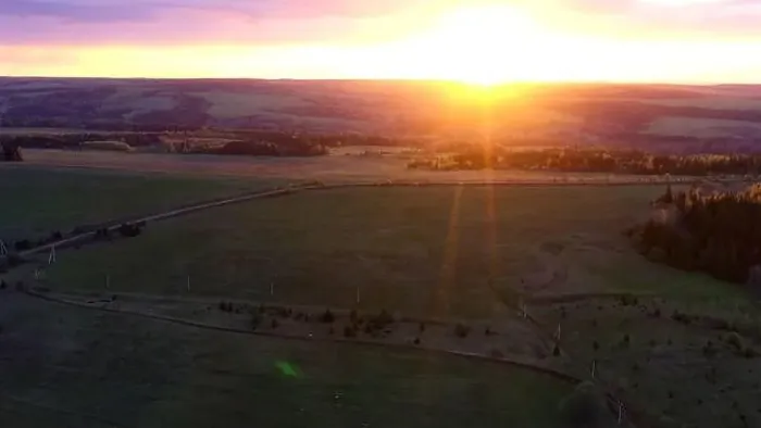 Framed Print : Aerial cinematic panoramic view of the farm field during sunset. Clip. Drone flies over agriculture green field Framed Print : Aerial cinematic panoramic view of the farm field during sunset. Clip. Drone flies over agriculture green field