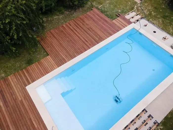 Framed Print : aerial drone flight over beautiful green garden with pool and the wooden deck of the pool is in progress Framed Print : aerial drone flight over beautiful green garden with pool and the wooden deck of the pool is in progress