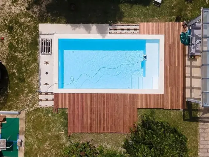 Framed Print : aerial drone flight over beautiful green garden with pool and the wooden deck of the pool is in progress Framed Print : aerial drone flight over beautiful green garden with pool and the wooden deck of the pool is in progress