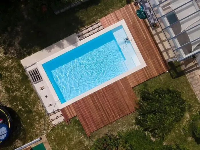Framed Print : aerial drone flight over beautiful green garden with pool and the wooden deck of the pool is in progress Framed Print : aerial drone flight over beautiful green garden with pool and the wooden deck of the pool is in progress