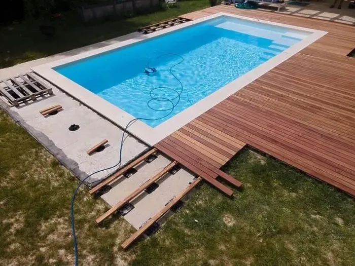 Framed Print : aerial drone flight over beautiful green garden with pool and the wooden deck of the pool is in progress Framed Print : aerial drone flight over beautiful green garden with pool and the wooden deck of the pool is in progress