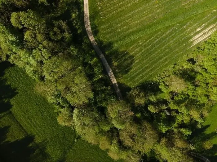 Framed Print : aerial drone flight over green meadows and forest in lower austria Framed Print : aerial drone flight over green meadows and forest in lower austria