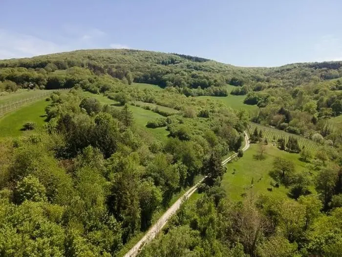 Framed Print : aerial drone flight photo of green hills, meadows and fresh forest in Lower Austria at the edge of Vienna Woods
