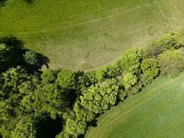 Framed Print : aerial drone flight photo of green hills, meadows and fresh forest in Lower Austria at the edge of Vienna Woods