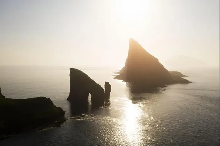Framed Print : Aerial drone flying over Drangarnir and Tindholmur sea stacks Framed Print : Aerial drone flying over Drangarnir and Tindholmur sea stacks